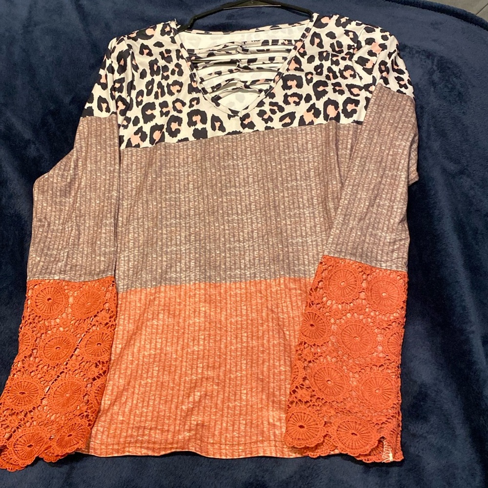 Women’s long sleeve multi colored blouse.